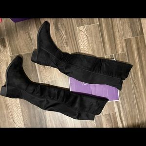 Over the knee flat boots